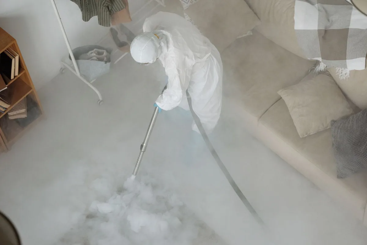 Biohazard cleanup technician in protective equipment, Bogart, GA